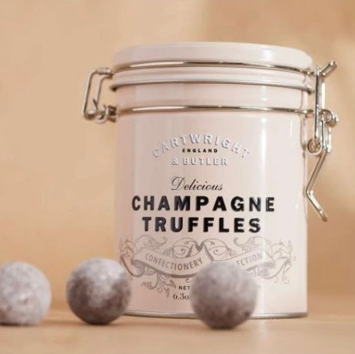 Marc De Champagne Truffles Čokoládové pralinky s náplní se šampaňským v plechovce, 180 g