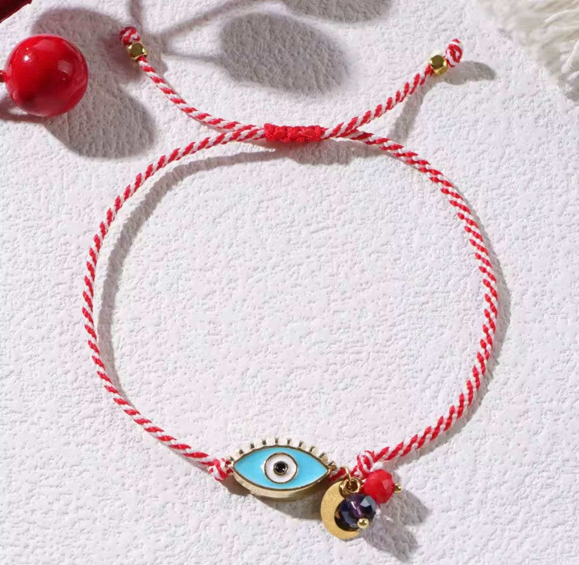 Náramek ochranné oko – červeno‑bílý provázek